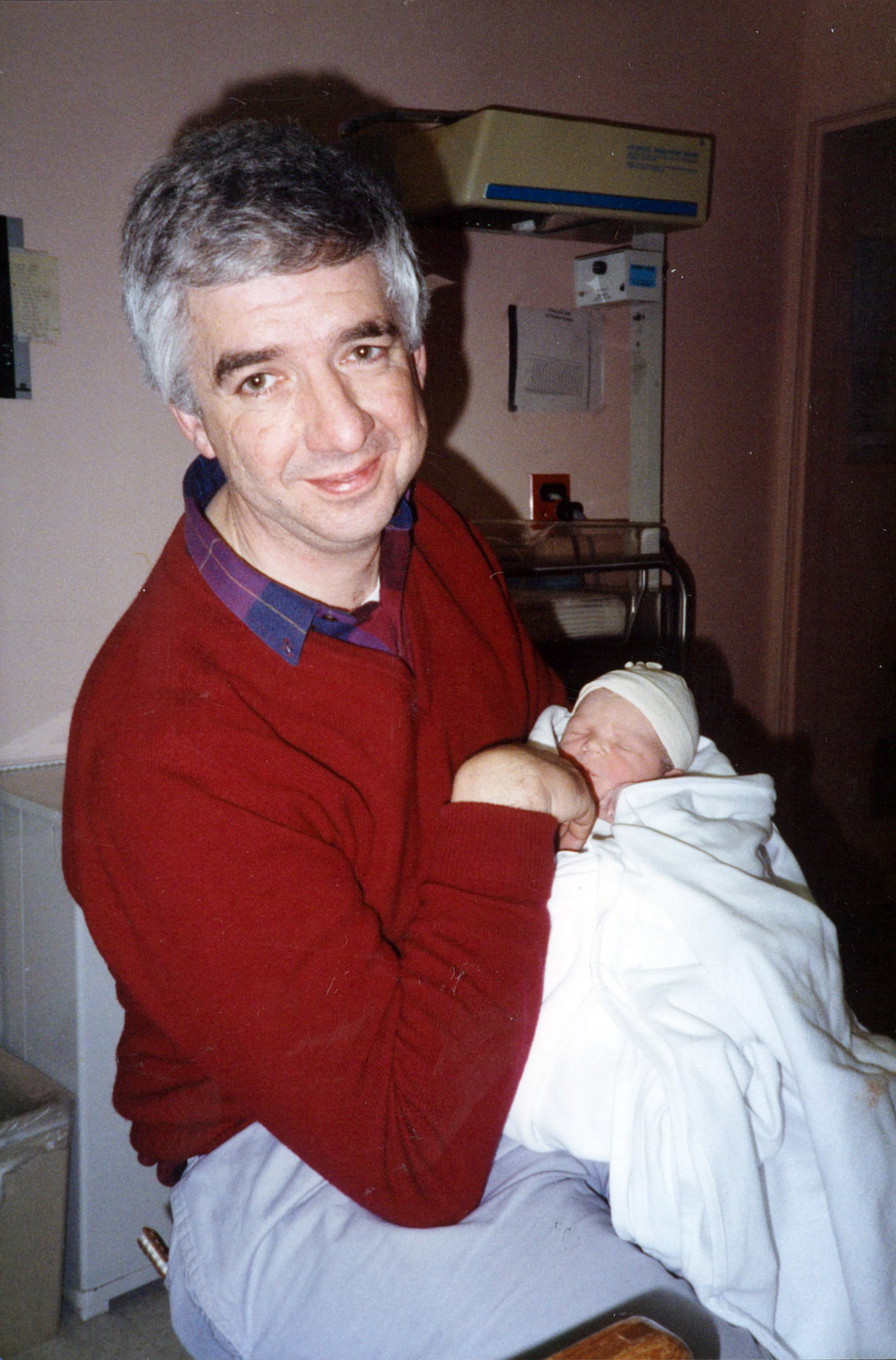 Dave holding newborn Matt