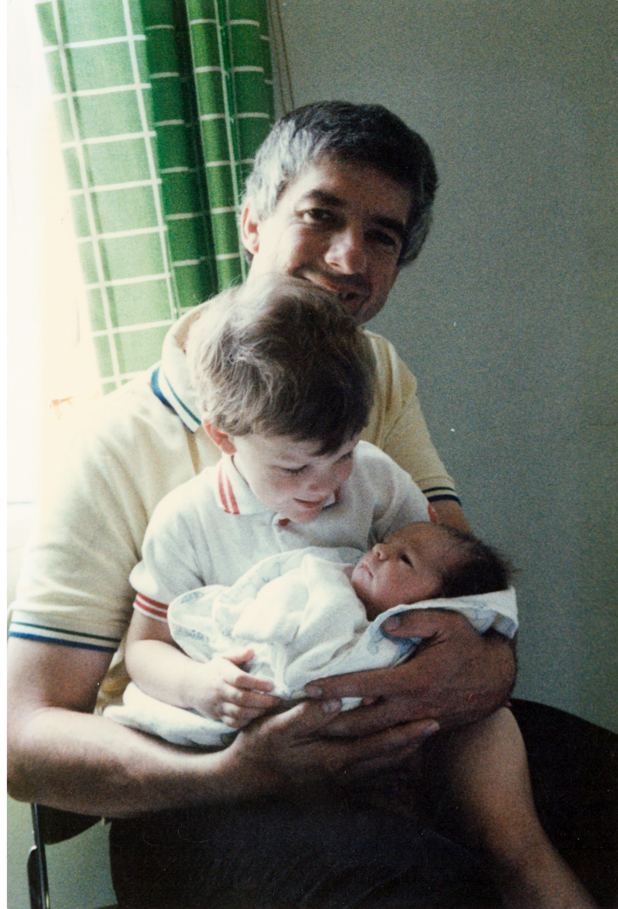 Jonathan holding newborn Danny